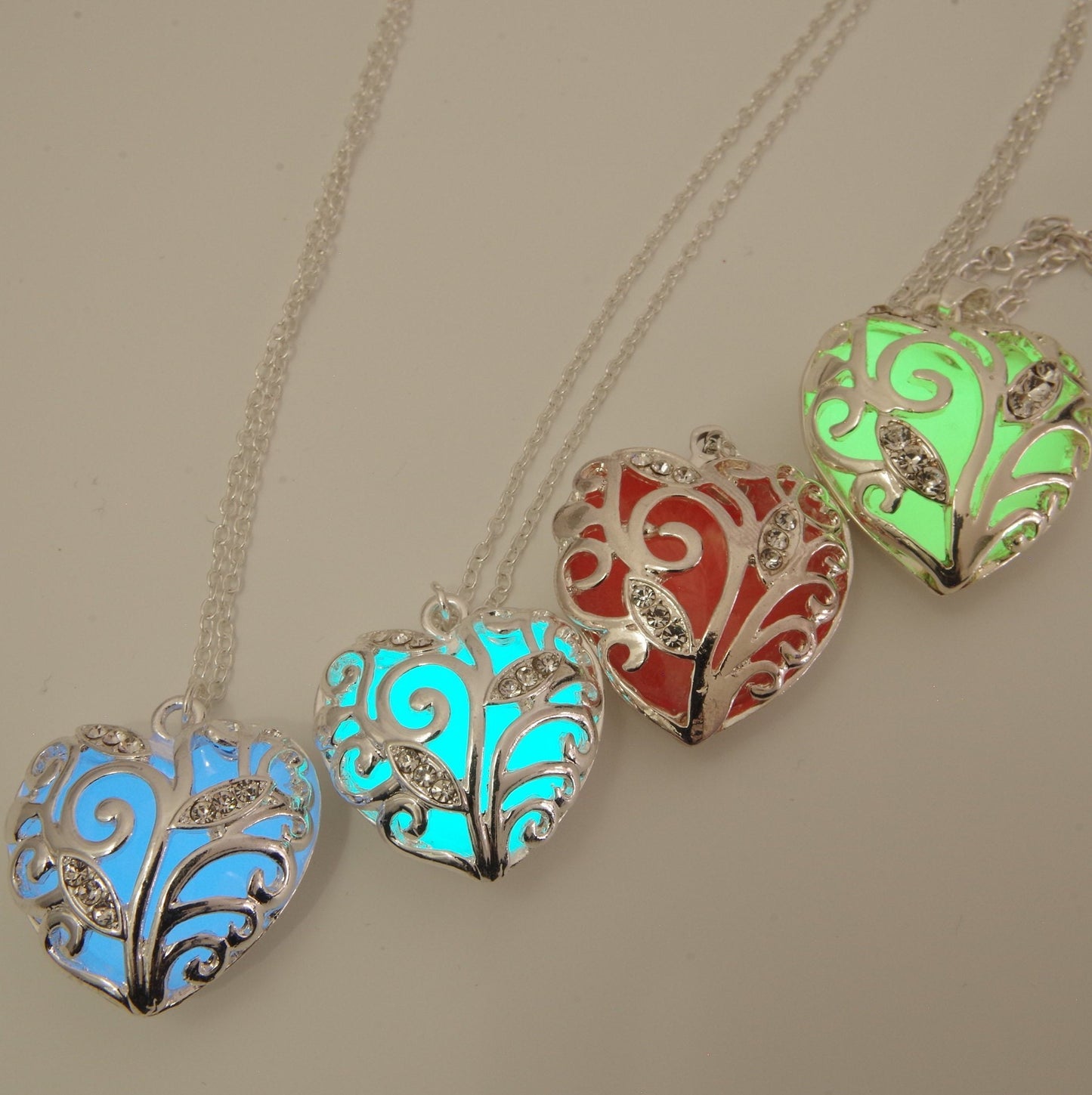 Small blue glowing heart necklace Glowing heart of winter jewelry blue heart glow in the dark Pendant Frozen heart necklace Christmas gift