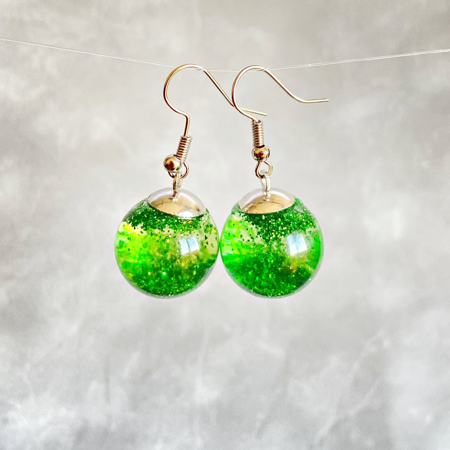 Green sequins floating in a glass bottle earrings Snow globe jewelry Glass globe flying snowflakes winter jewelry Christmas gift for women