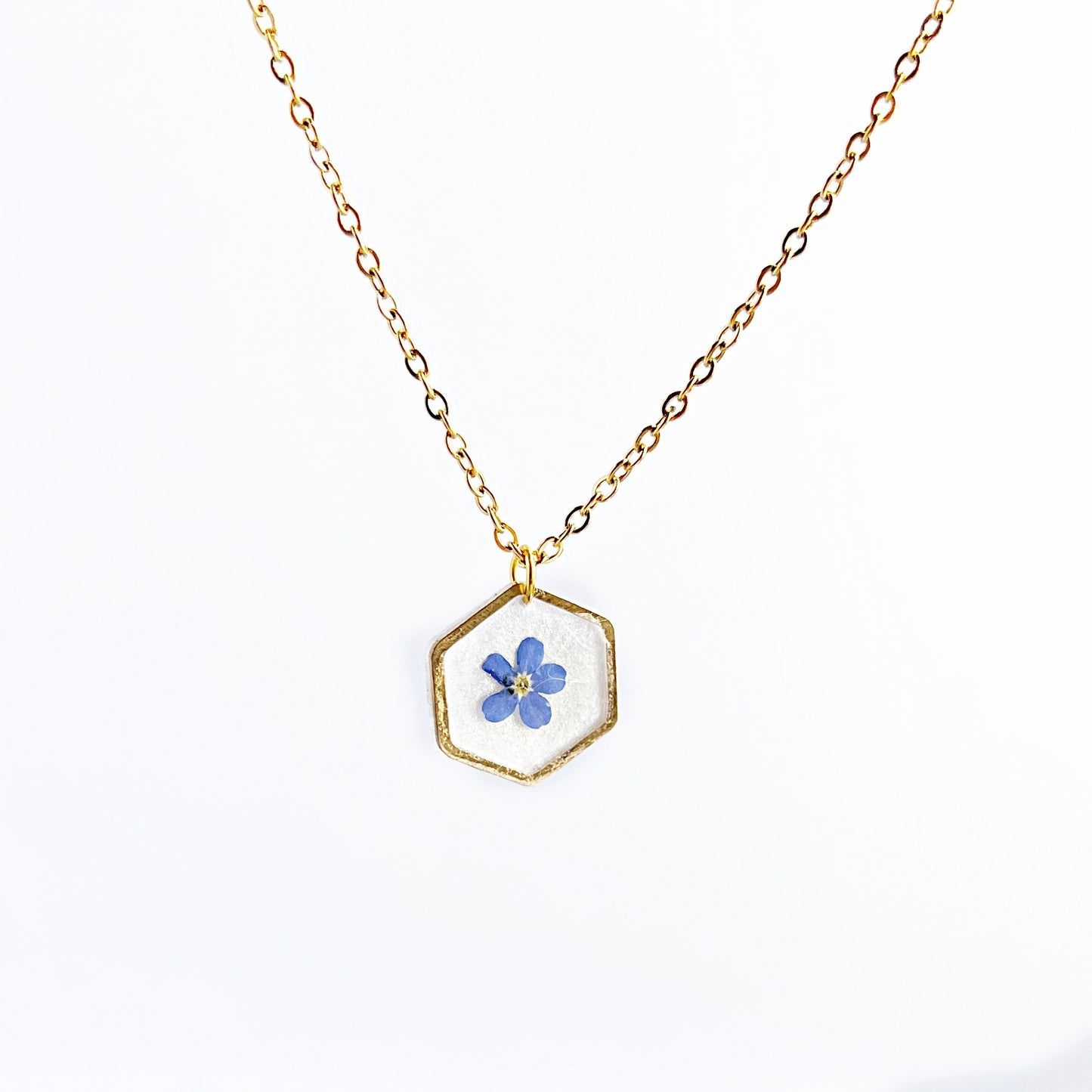 Small blue forget-me-not flower in resin necklace for women flower in hexagonal gold pendants Minimalist jewelry gifts for her