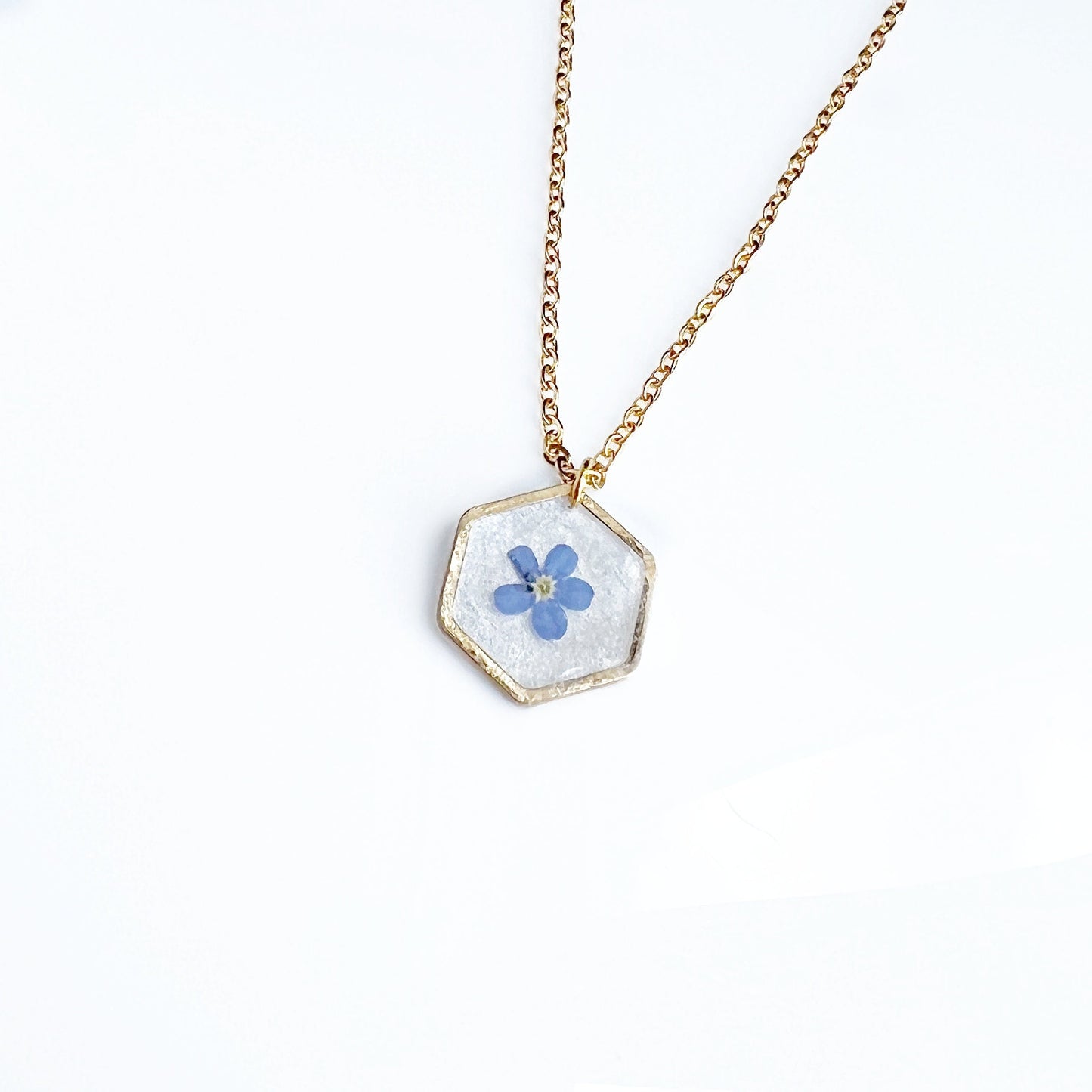 Small blue forget-me-not flower in resin necklace for women flower in hexagonal gold pendants Minimalist jewelry gifts for her