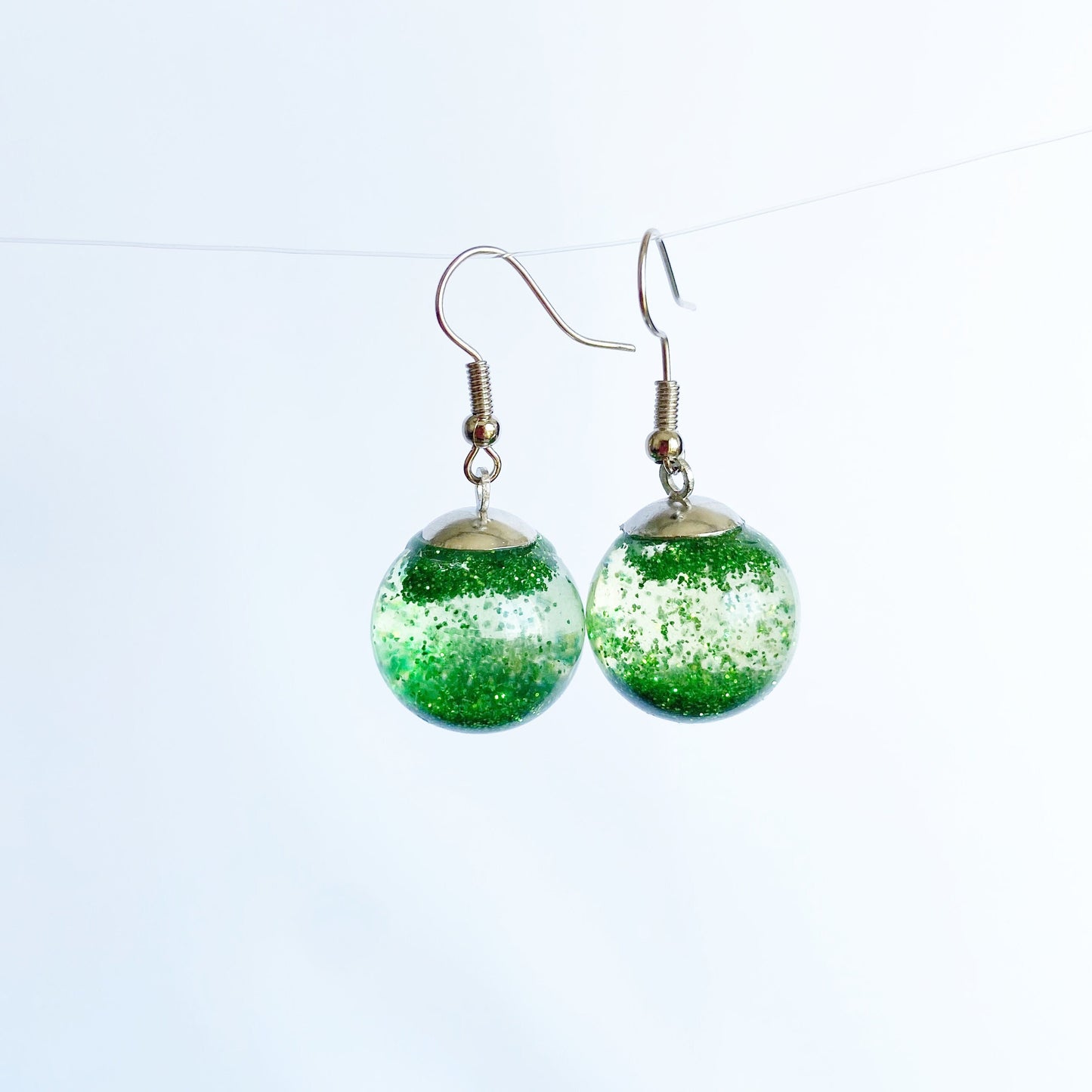 Green sequins floating in a glass bottle earrings Snow globe jewelry Glass globe flying snowflakes winter jewelry Christmas gift for women
