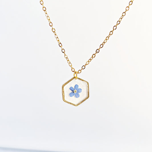 Small blue forget-me-not flower in resin necklace for women  flower in hexagonal gold pendants Minimalist jewelry gifts for her